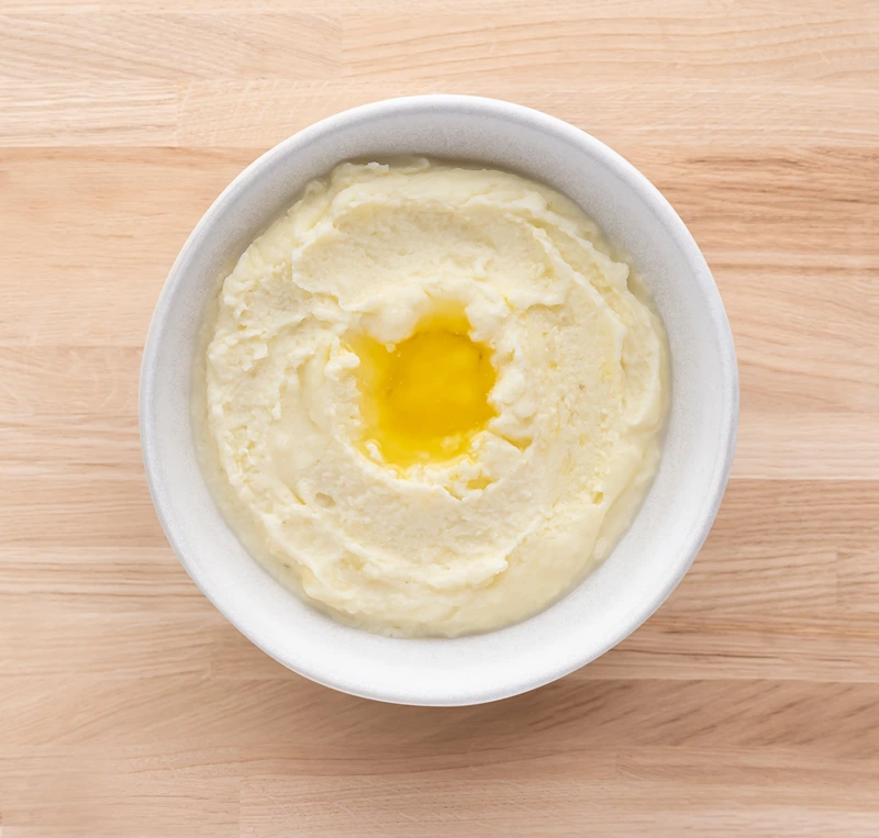 A bowl of creamy mashed potatoes, one of Christmas veggie dishes.