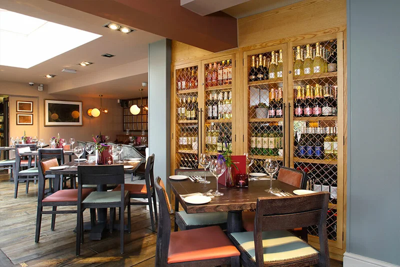 Cosy table setting at The Inn at Maybury, one of the popular Woking places to eat.