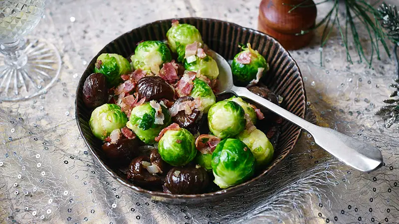 A bowl of Brussels sprouts with chestnuts, ideal for Xmas dinner veg.