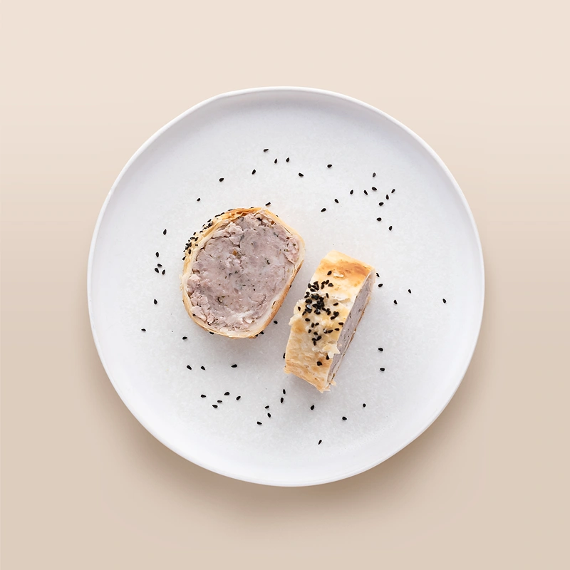 A serving of Pork and Sausage Roll for starter ideas for Christmas.