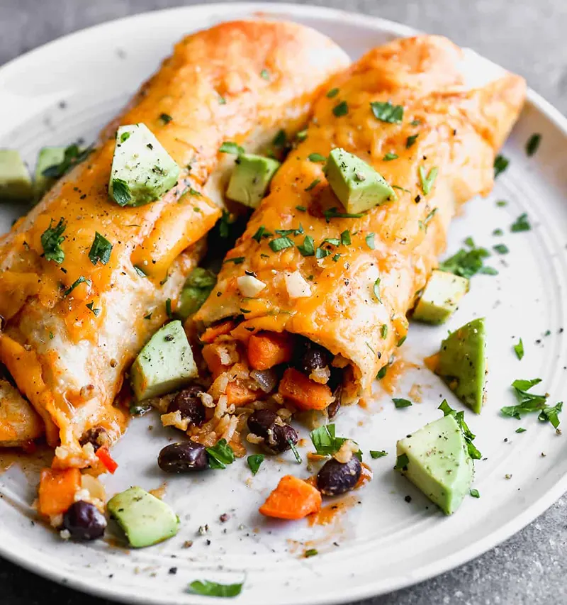 A serving of enchiladas made using an enchiladas recipe vegetarian version.