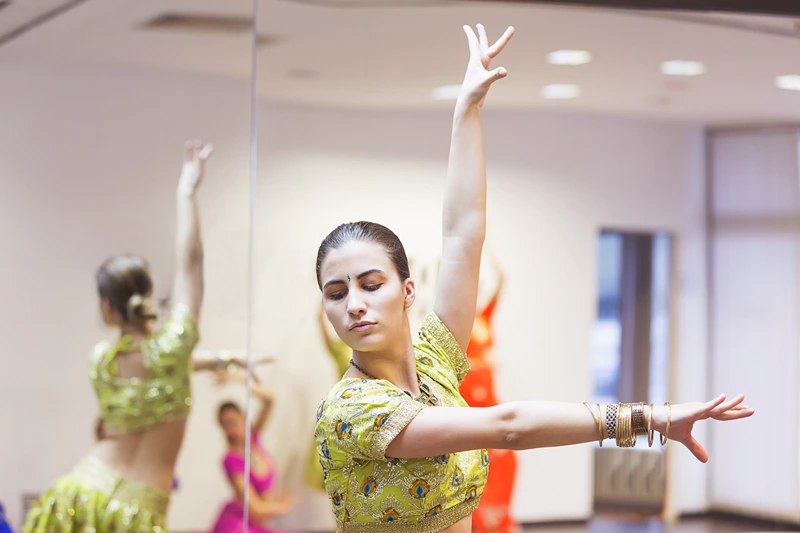 A woman at a Bollywood dance class, one of hen do activities Birmingham offers.