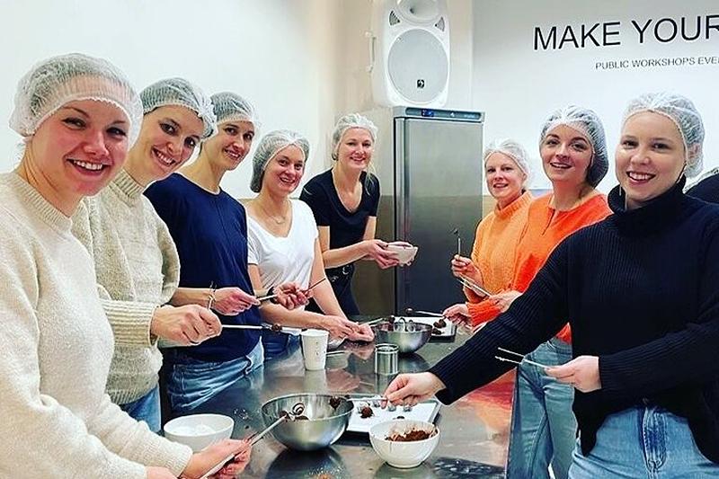 Hens enjoying a chocolate-making class, one of hen party ideas Birmingham offers.