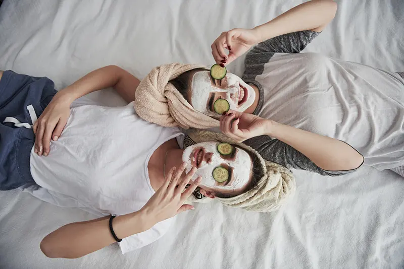 Two women at a spa, enjoying a hen weekend in Birmingham.