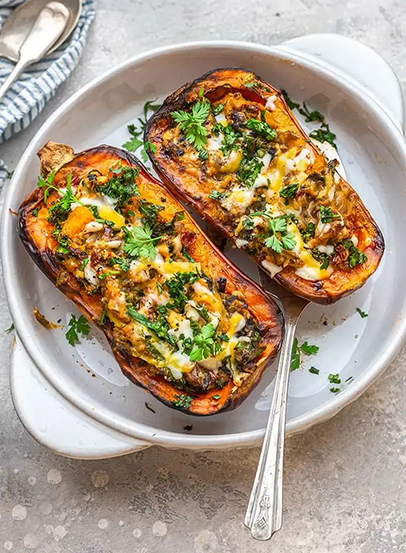 A plate of stuffed butternut squash, perfect for a veggie Christmas main.