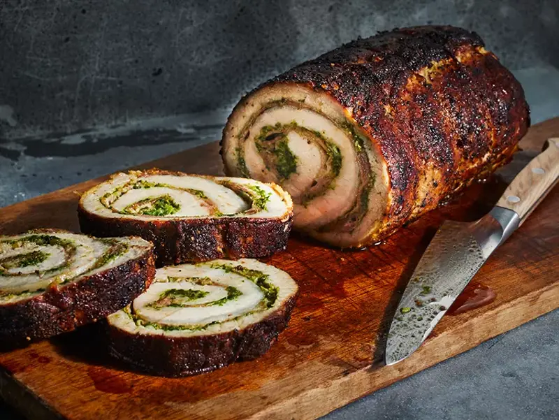 Slices of stuffed pork loin as New Year's Eve food ideas for families.