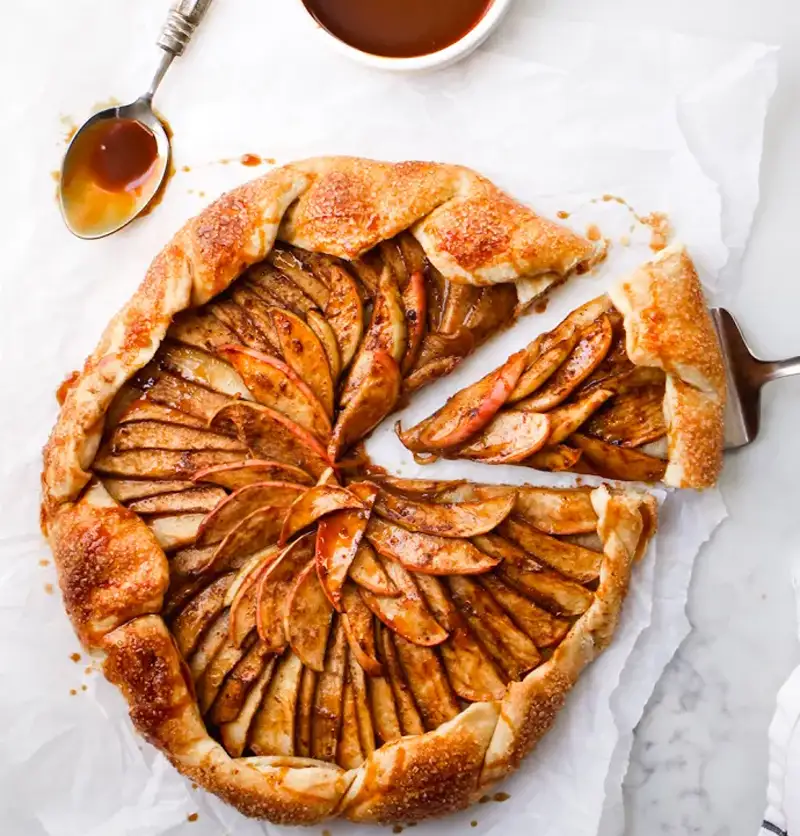 Spiced apple tart with caramel sauce, among New Year’s Eve menu ideas.