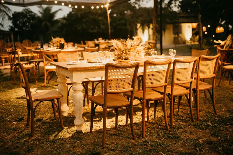 Beautifully lit decor and table setting showcasing dinner party ideas for summer.