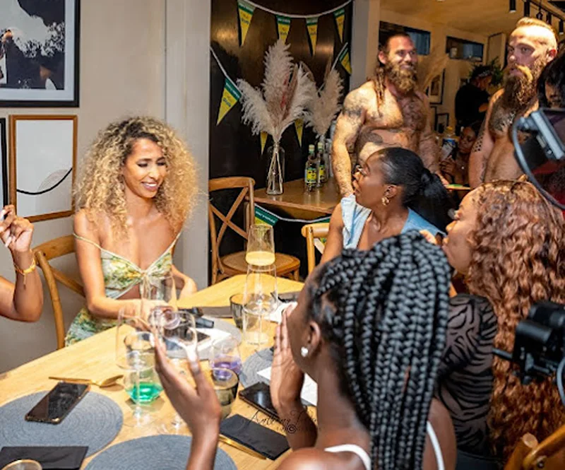 Women awaiting their next course at a hen party catering.