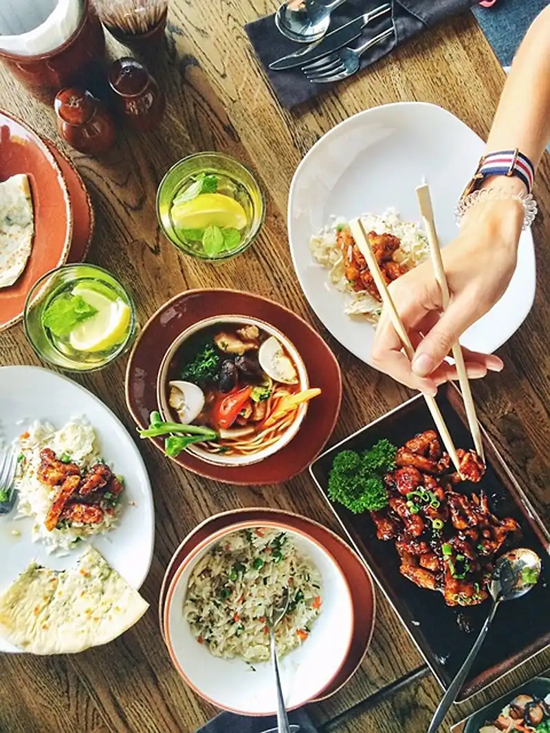 Variety of dishes arranged on a table for a summer dinner party menu.