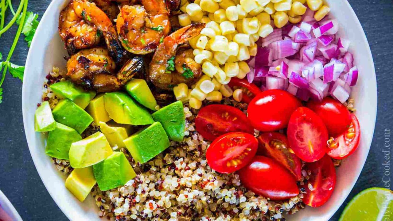 A shrimp bowl with quinoa is a flavourful, high-protein lunch meal prep idea.